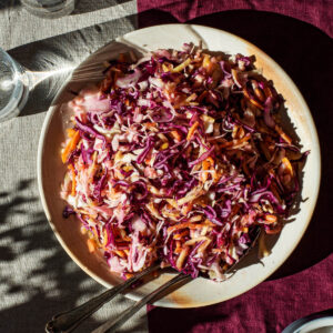 Vegan coleslaw on a serving plate.