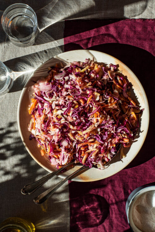 Vegan coleslaw on a serving plate.