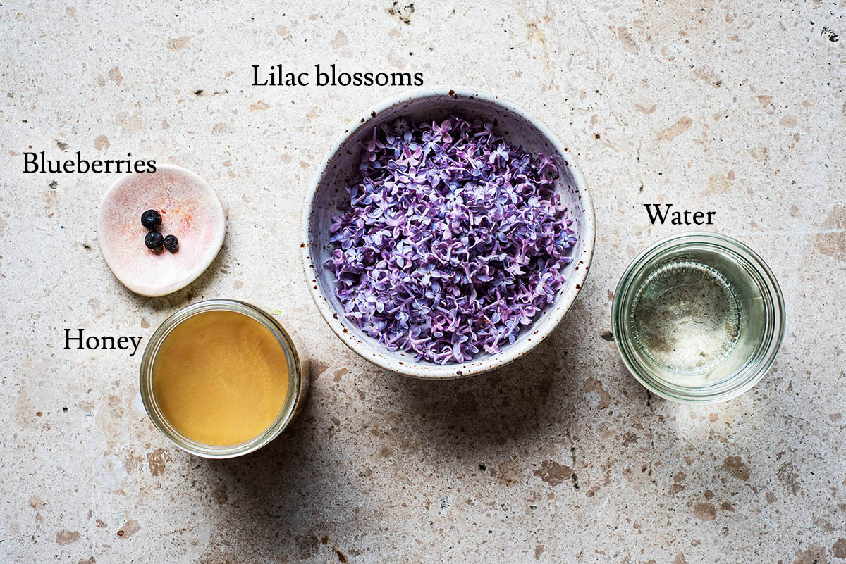 Lilac syrup ingredients with labels.