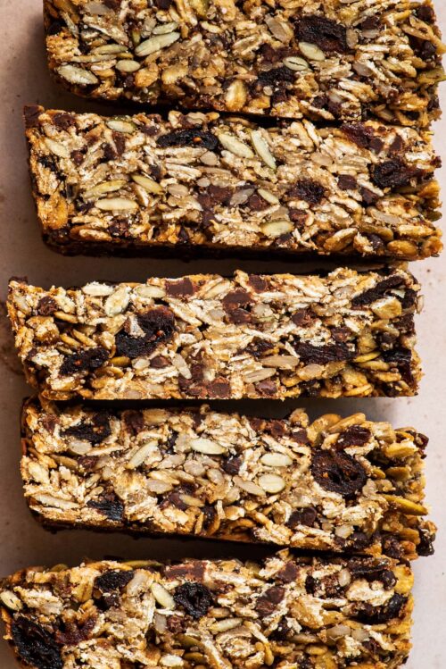 Close up of granola bars on their sides to show interior texture.