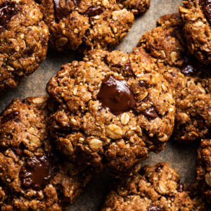 Cookies scattered on baking paper.