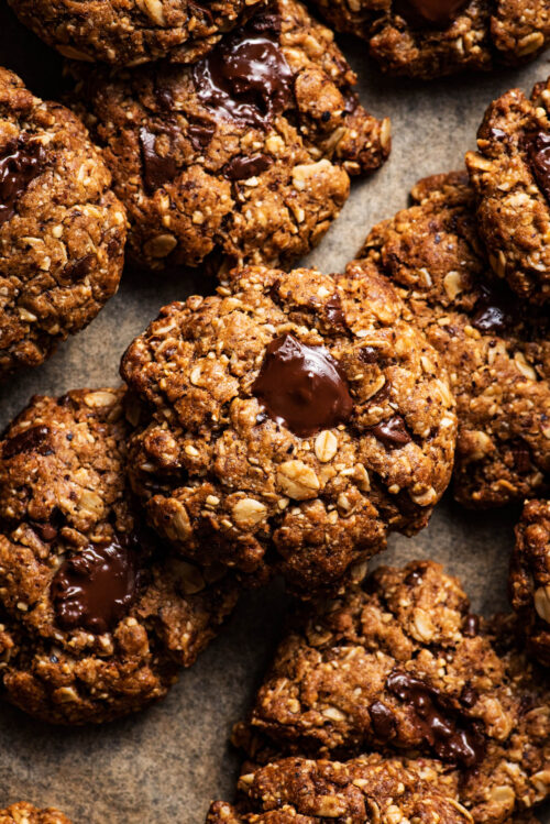 Cookies scattered on baking paper.