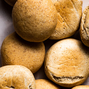 A pile of golden buns, close up.