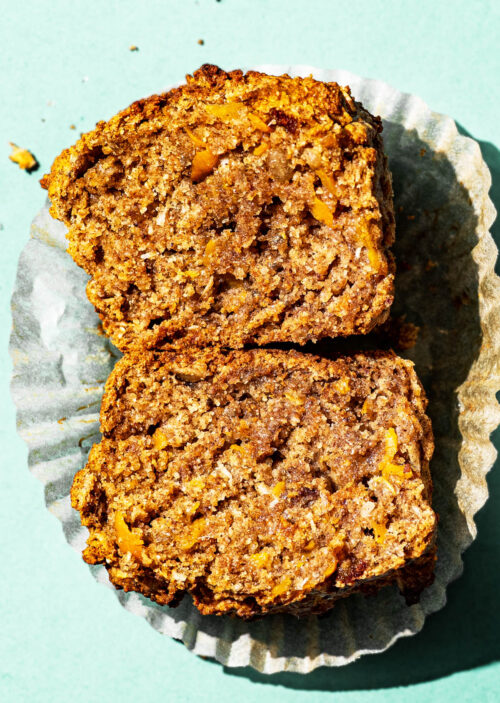 A carrot muffin close up, halved to show interior texture.