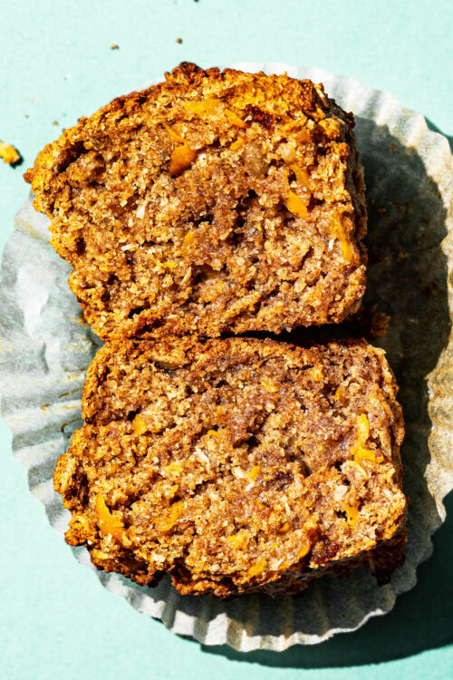 A carrot muffin close up, halved to show interior texture.