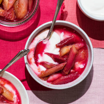 Stewed rhubarb in small bowls with yogurt.