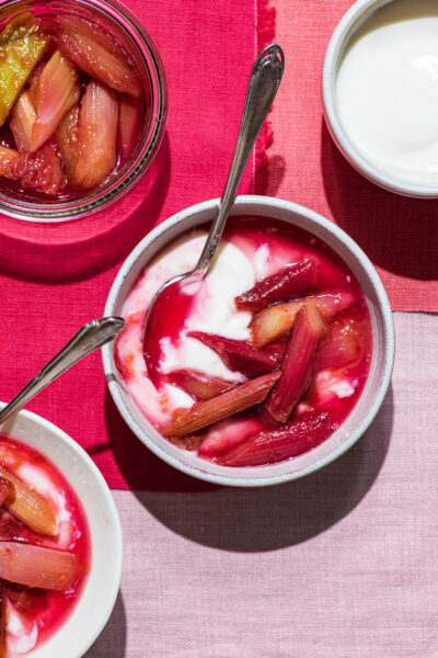 Stewed rhubarb in small bowls with yogurt.