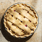 An unbaked lattice pie, top down view.