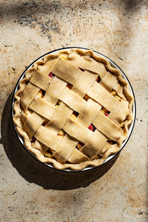 An unbaked lattice pie, top down view.