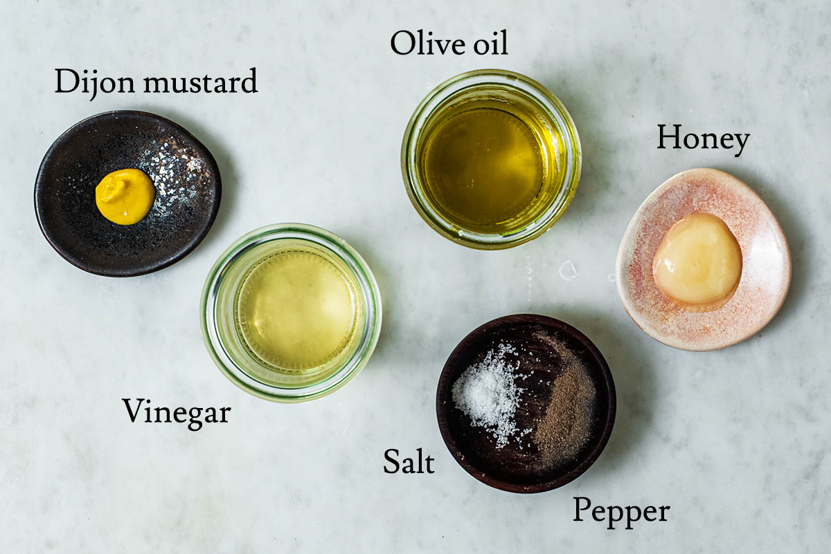 Mustard vinaigrette ingredients with labels.