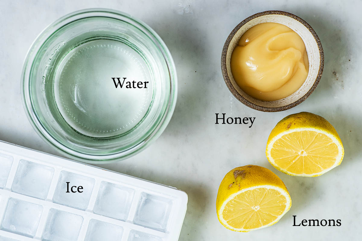 Honey lemonade ingredients with labels.