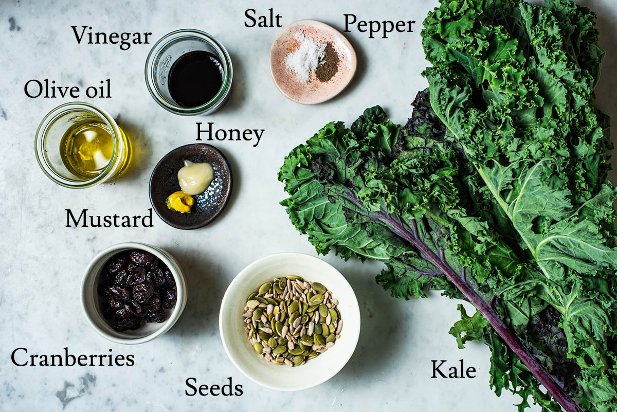 Kale salad ingredients with labels.