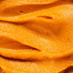 Close up of swirled pureed sweet potato.