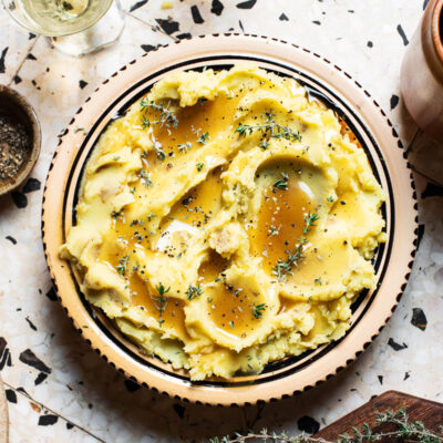 Gravy-topped mashed potatoes with thyme.