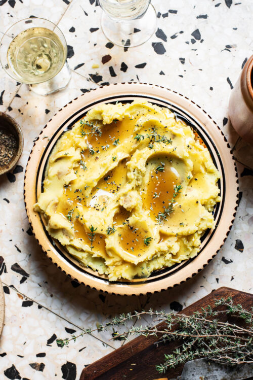 Gravy-topped mashed potatoes with thyme.