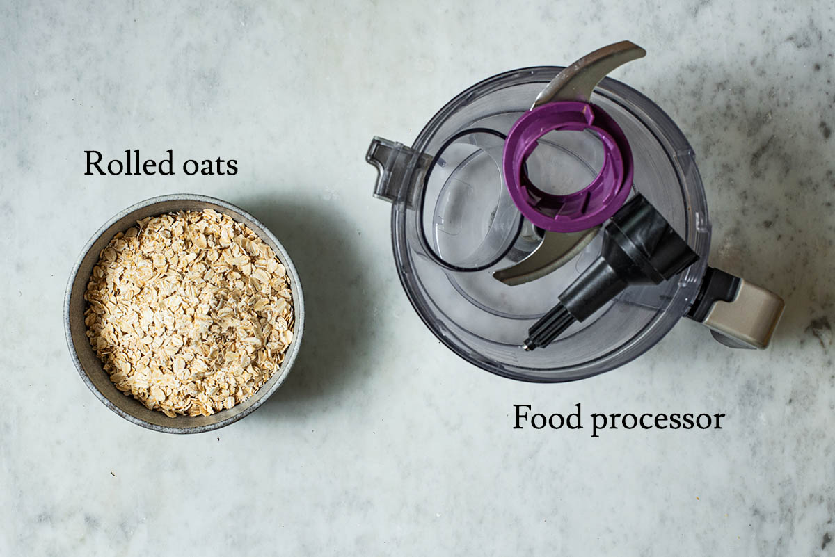Rolled oats and a food processor, labeled. 
