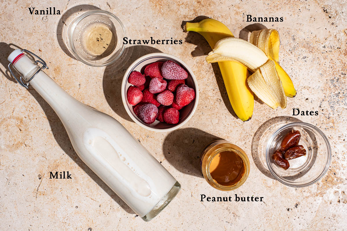 Strawberry smoothie ingredients with labels.