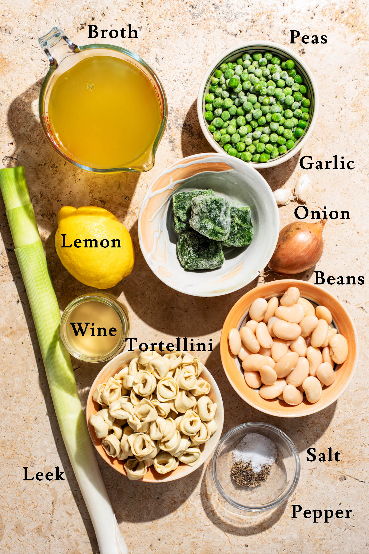 Tortellini soup ingredients with labels.