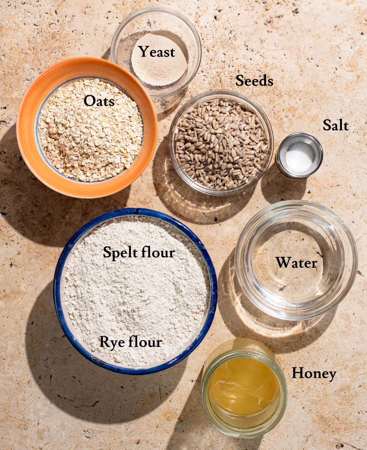 Spelt seed bread ingredients with labels.