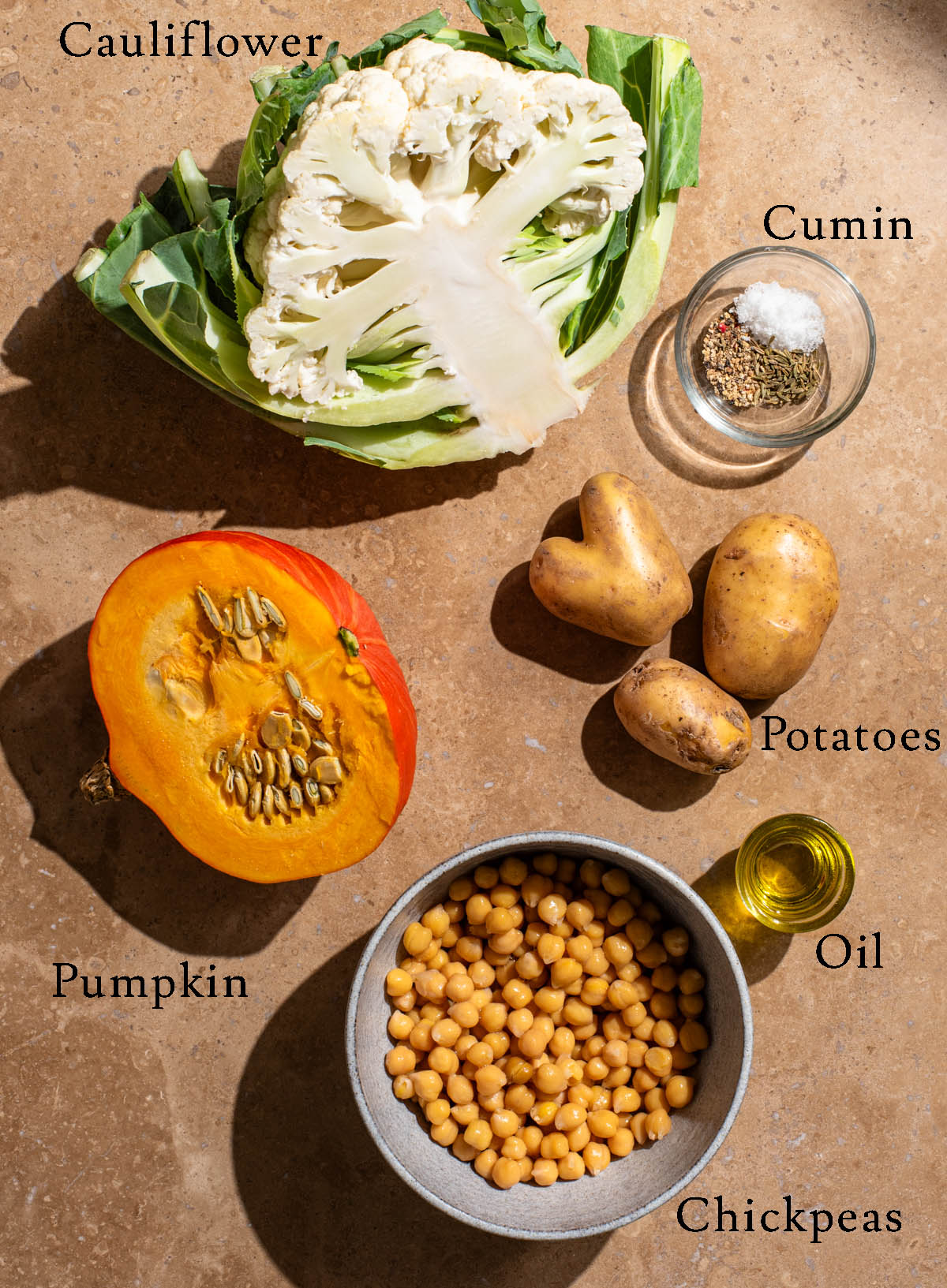 Pumpkin cauliflower tray bake ingredients with labels.