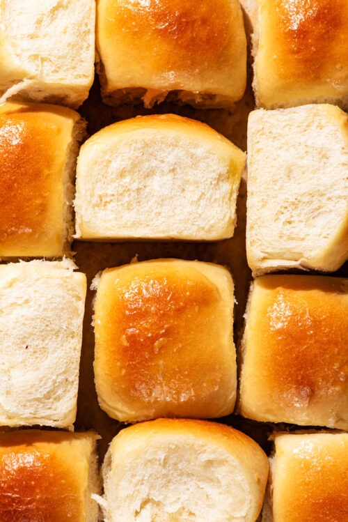 Dinner rolls arranged together to show all sides of the buns.