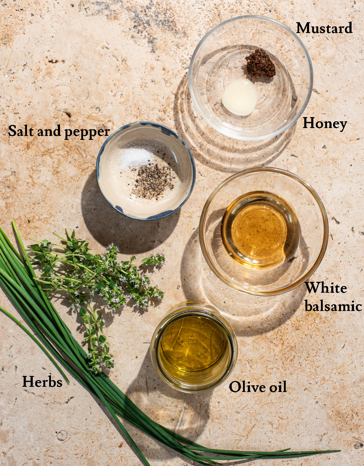 White balsamic vinaigrette ingredients with labels.