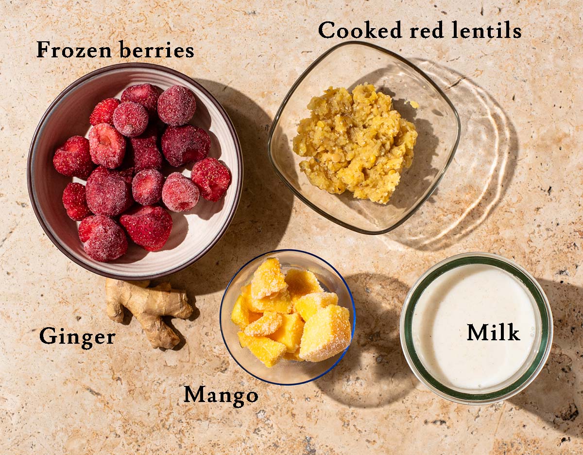 Strawberry mango smoothie ingredients with labels.