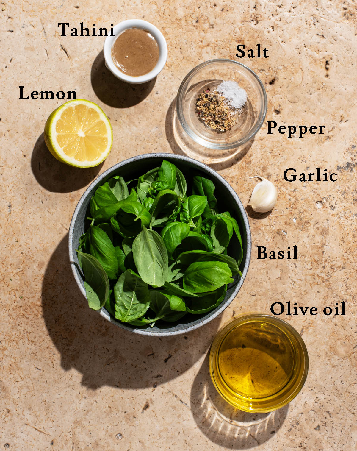 Pesto vinaigrette ingredients with labels.