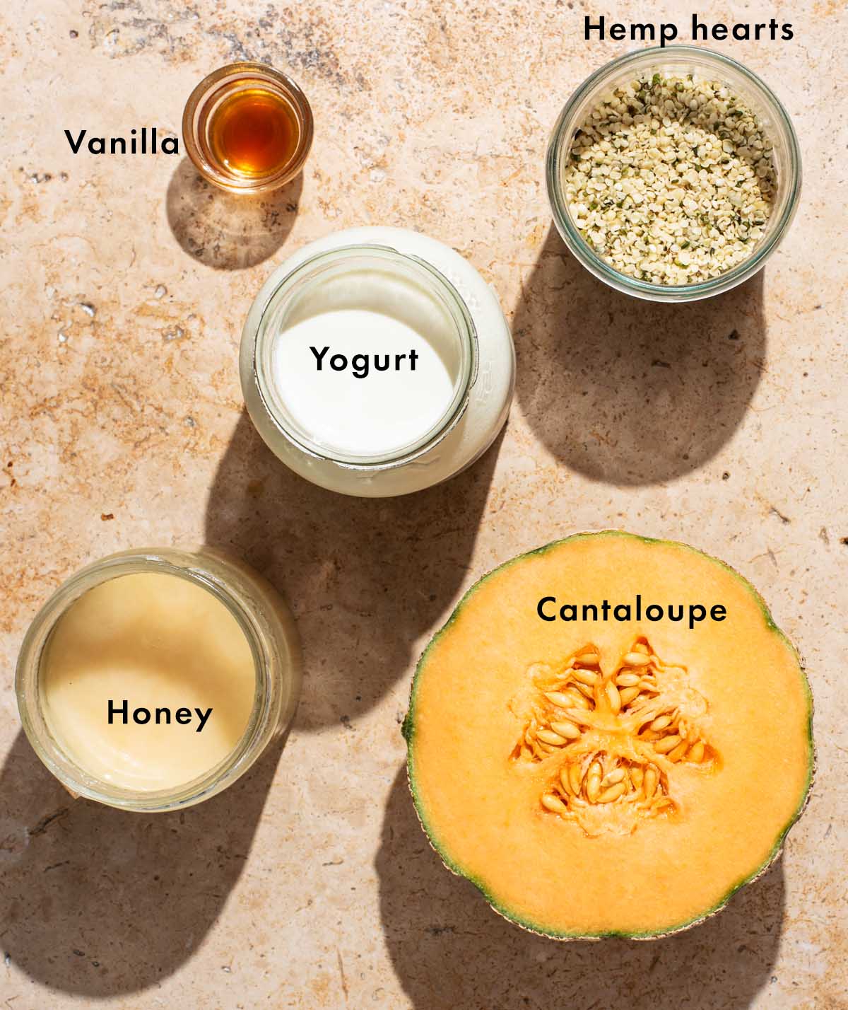 Cantaloupe smoothie ingredients with labels.