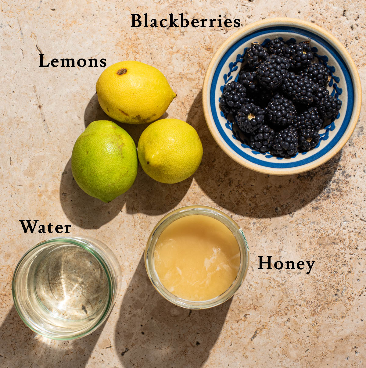 Blackberry lemonade ingredients with labels.