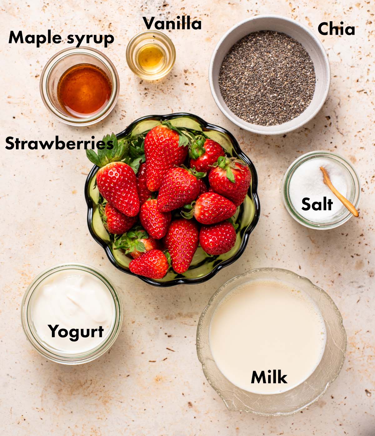 Strawberry chia pudding ingredients with labels.