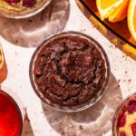 Ramekins with a baked blended oatmeal, with tea and orange slices nearby.