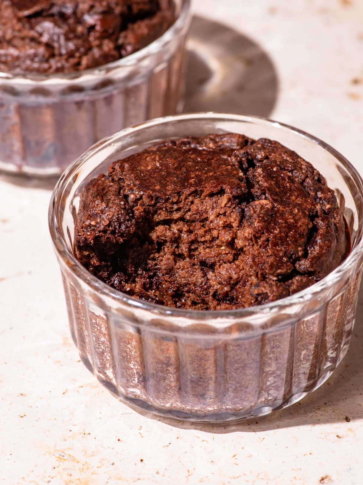 Close up of cocoa baked oats with a spoonful taken out to show