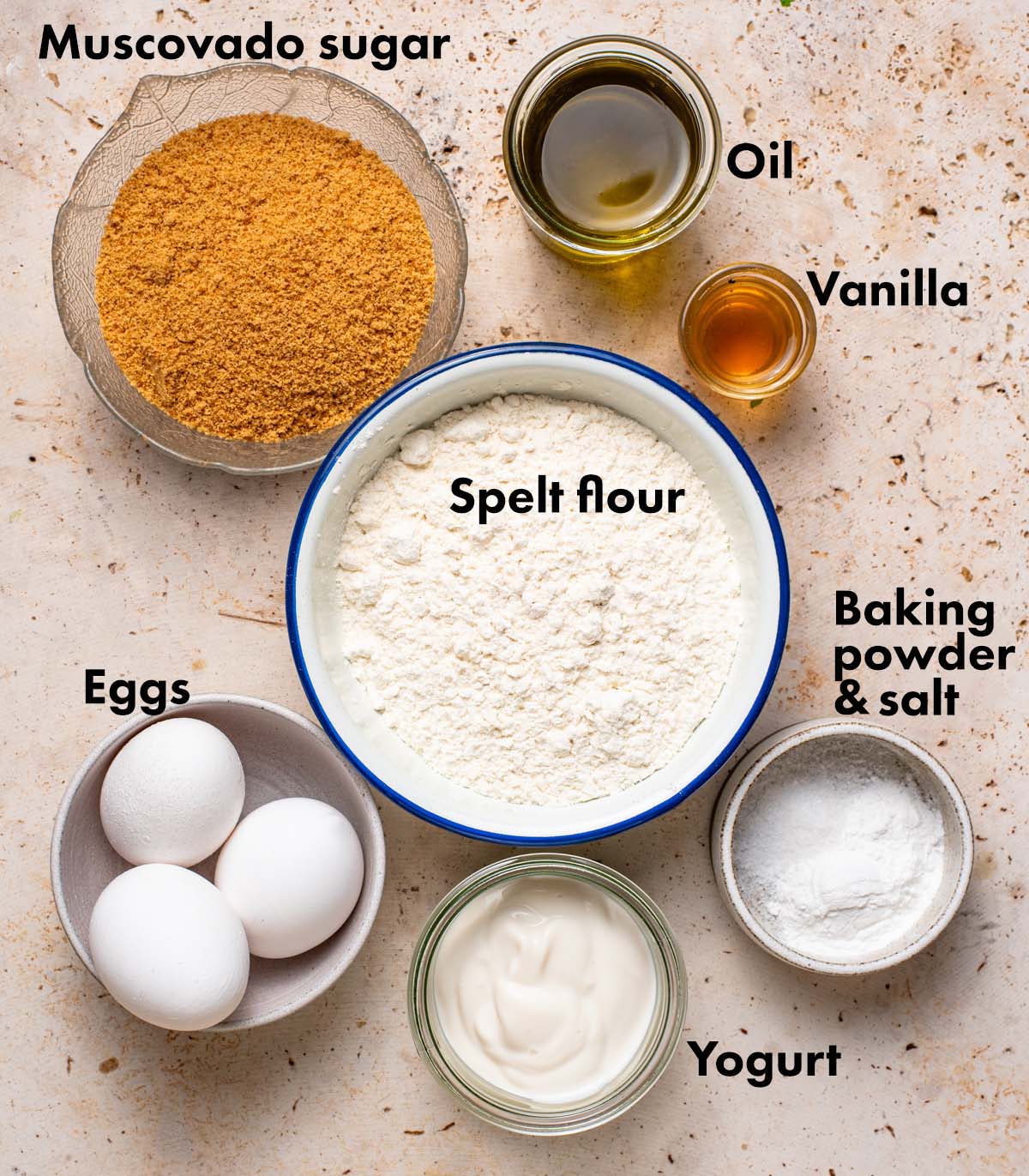 Vanilla spelt cake ingredients with labels.