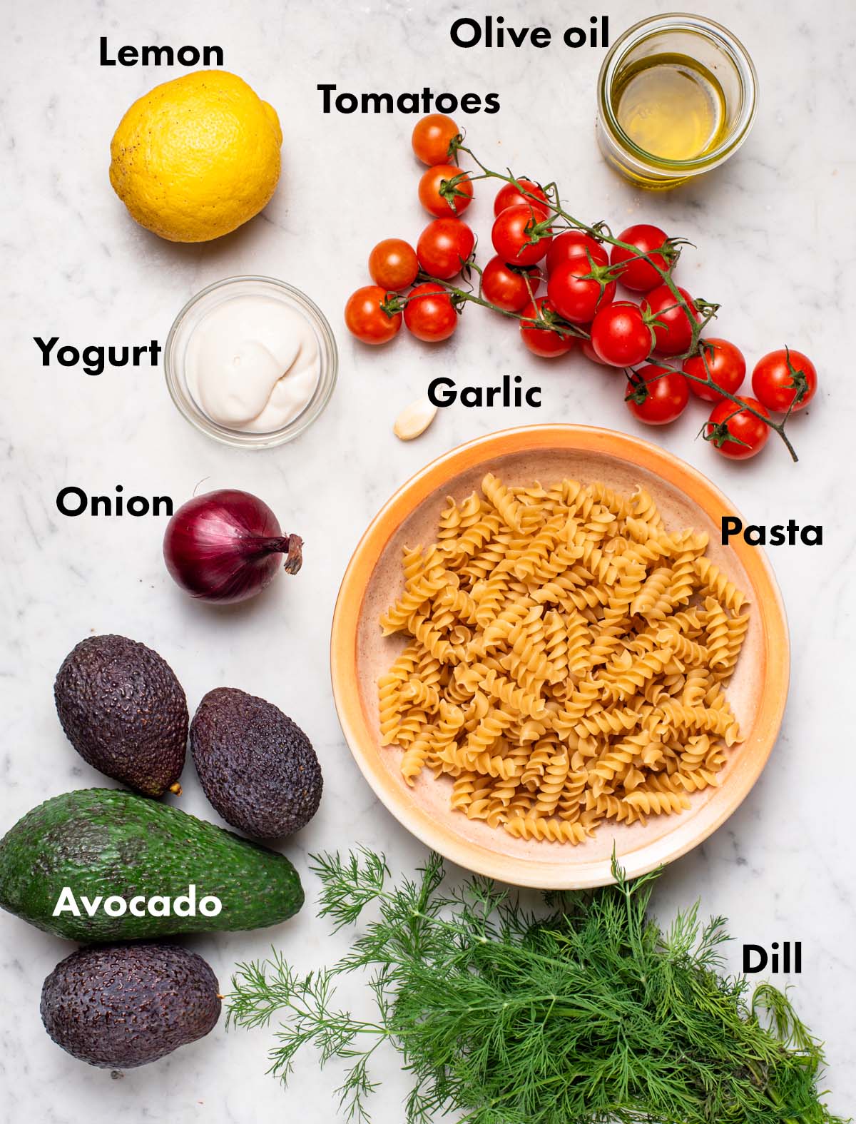 Avocado pasta salad ingredients with labels.