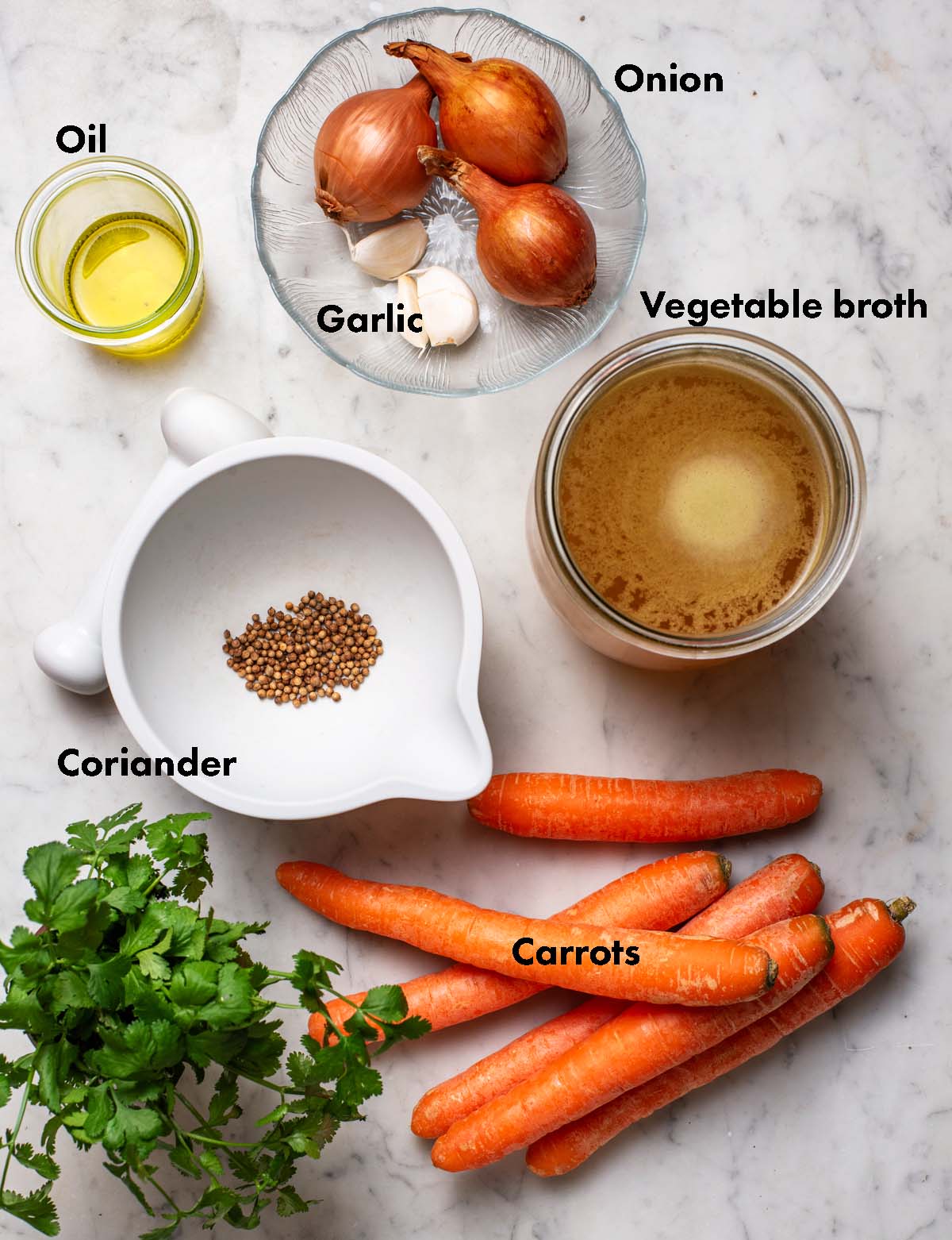 Carrot coriander soup ingredients with labels.