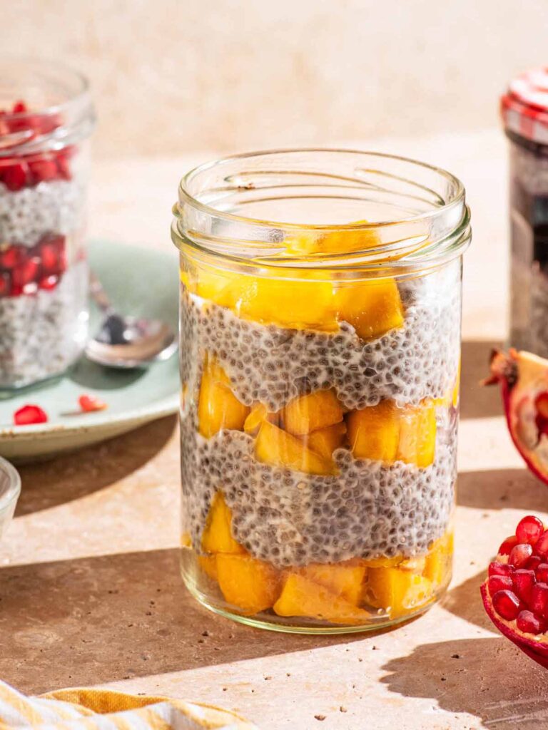 Chia pudding in jars layered with fruit.