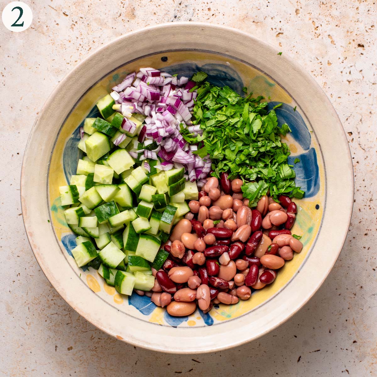 Salad step 2, all elements added to a bowl before mixing.