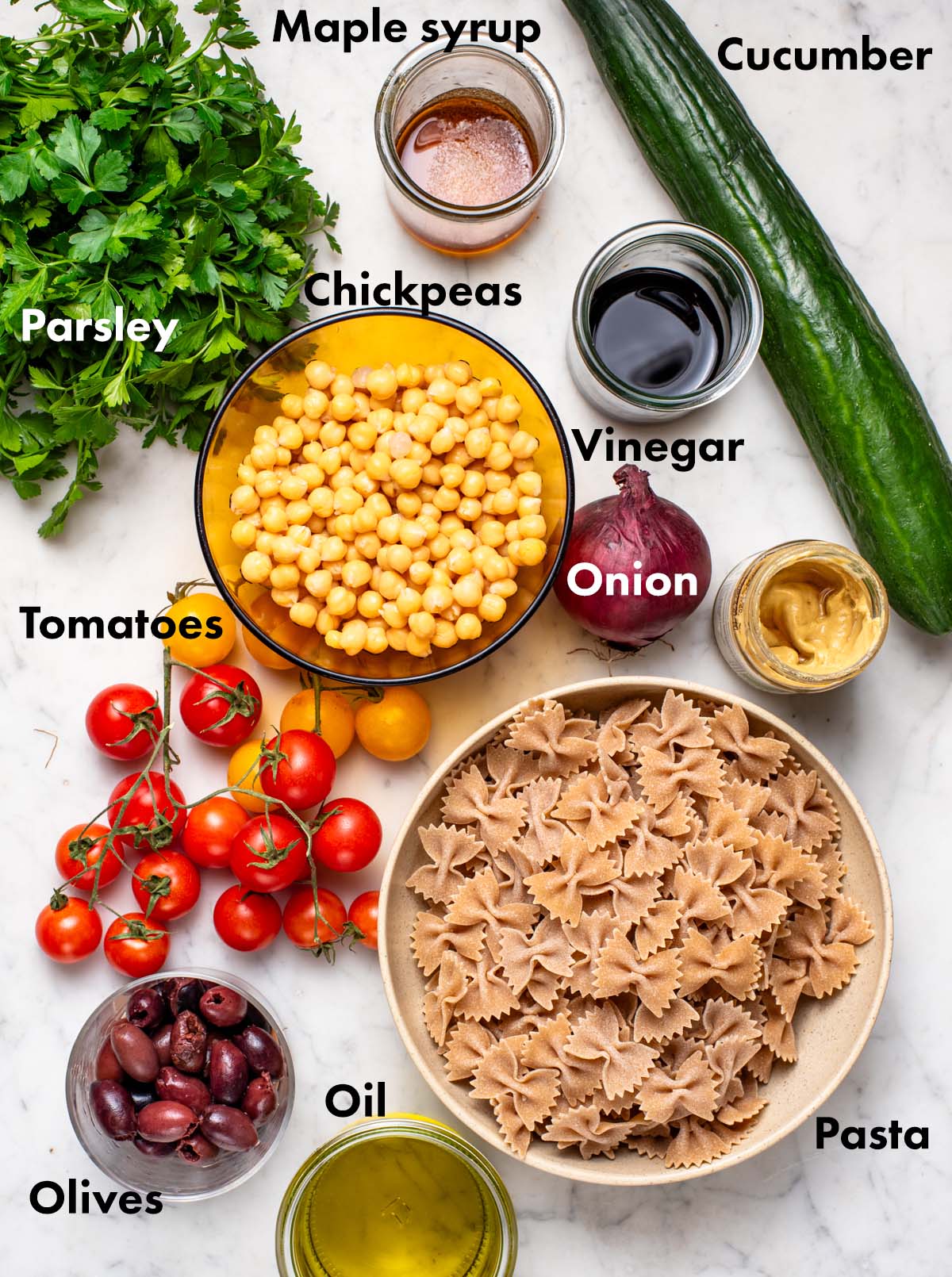 Chickpea pasta salad ingredients with labels.