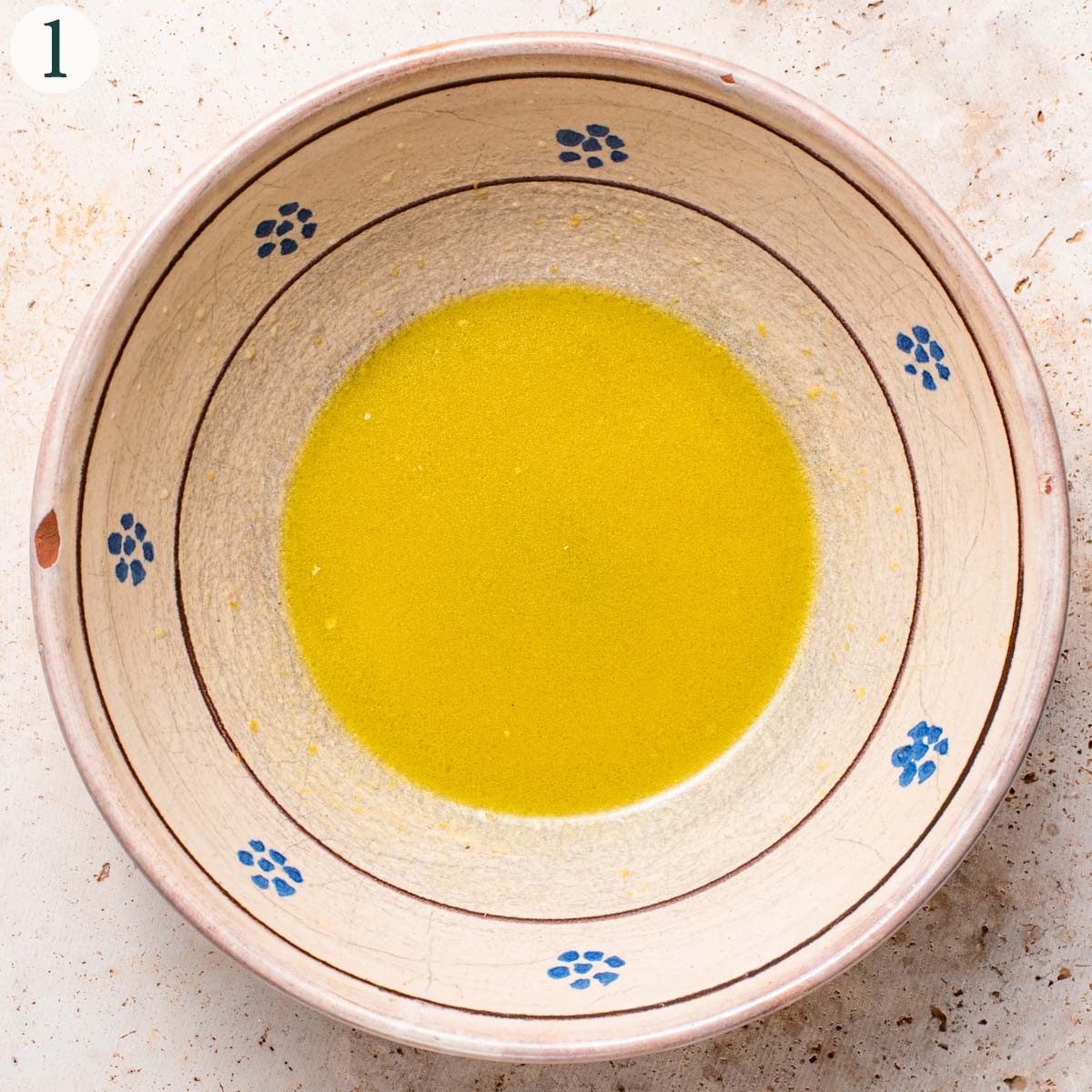 Salad step 1, vinaigrette in a mixing bowl.