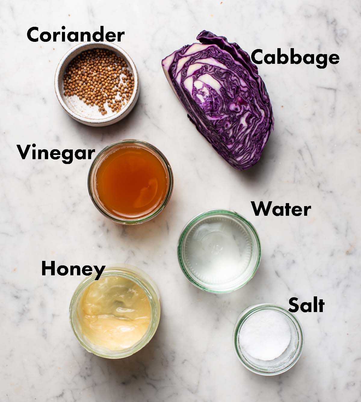 Pickled cabbage ingredients with labels.
