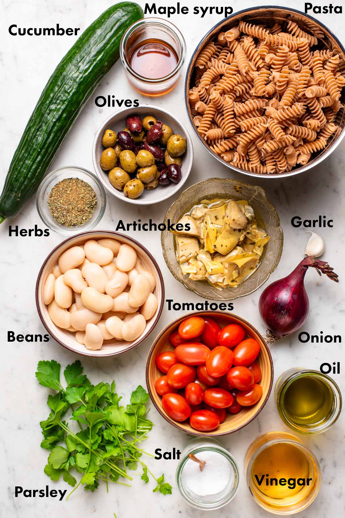 Vegan pasta salad ingredients with labels.